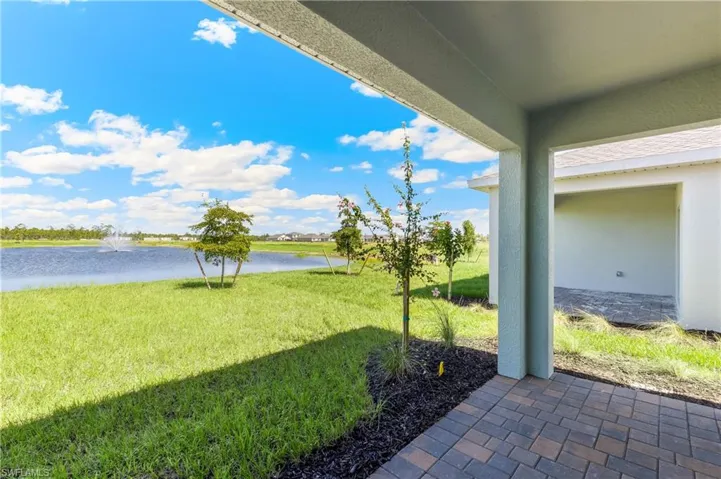 View of grassy yard featuring a water view