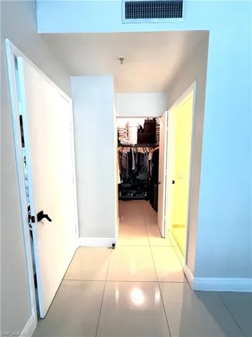 Hall featuring light tile flooring