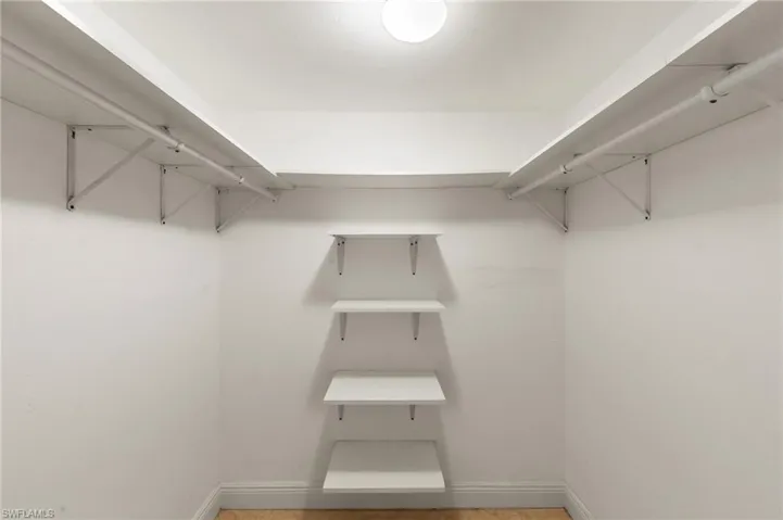 A walk-in closet that provides plentiful options