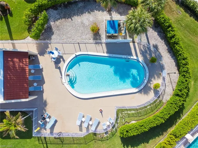 Lovely community pool with sitting areas
