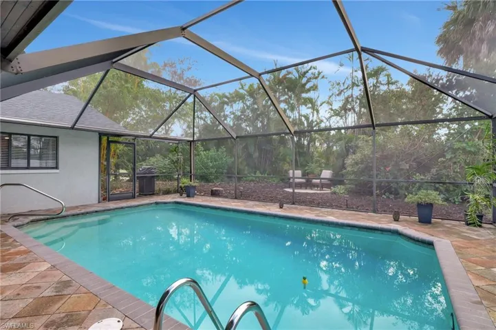 Pool featuring a patio and a lanai