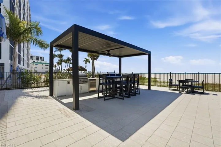 View of patio with an outdoor kitchen / dining area