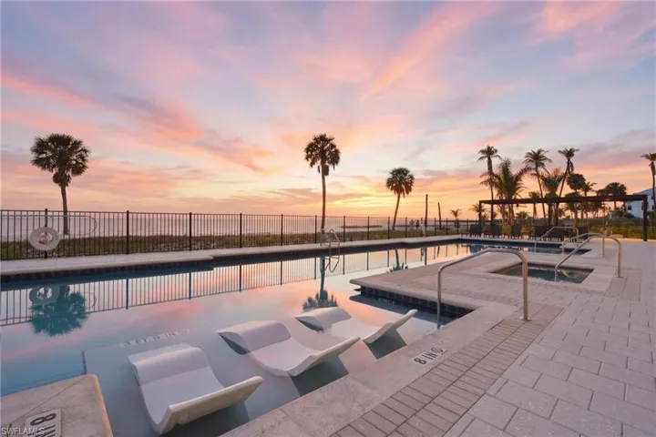 Pool at dusk with a community pool
