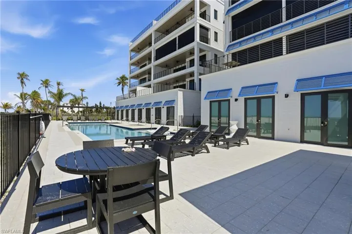 Community pool with a patio area