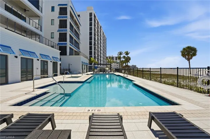 Community pool with a patio area