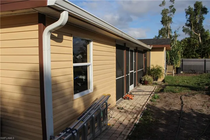 View of home's exterior featuring a sunroom