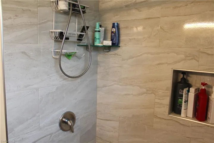 Bathroom view of a tile shower
