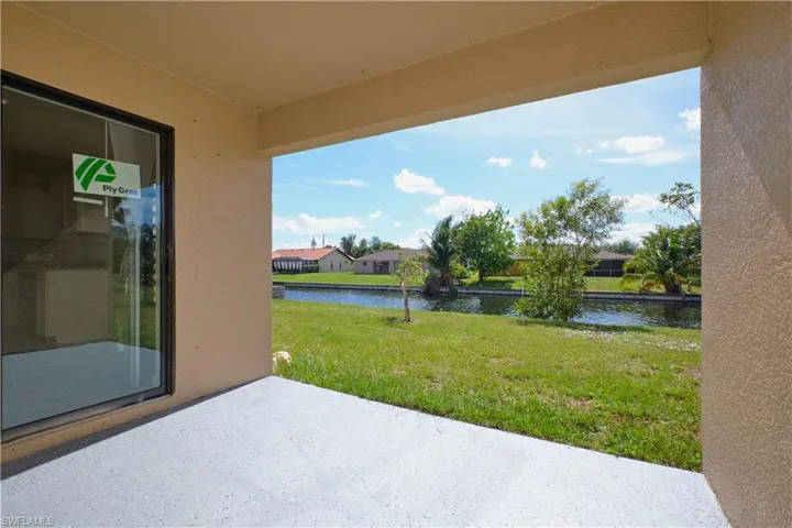 View of yard featuring a water view and a patio area