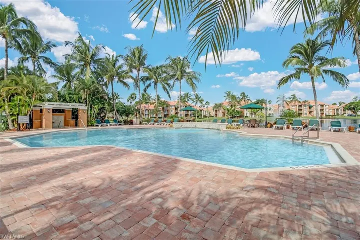 Community pool with a patio