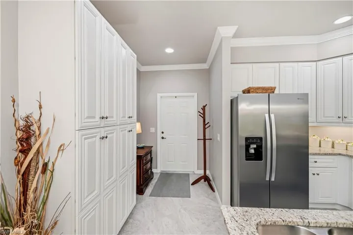 White wood cabinets with quartz countertops