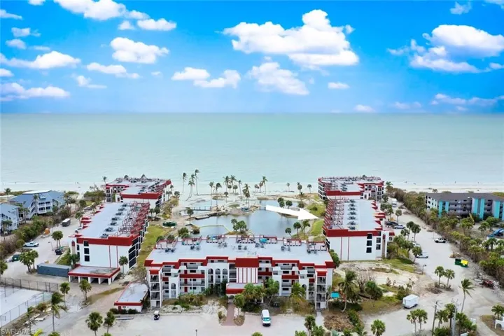 Birds eye view of property with a water view