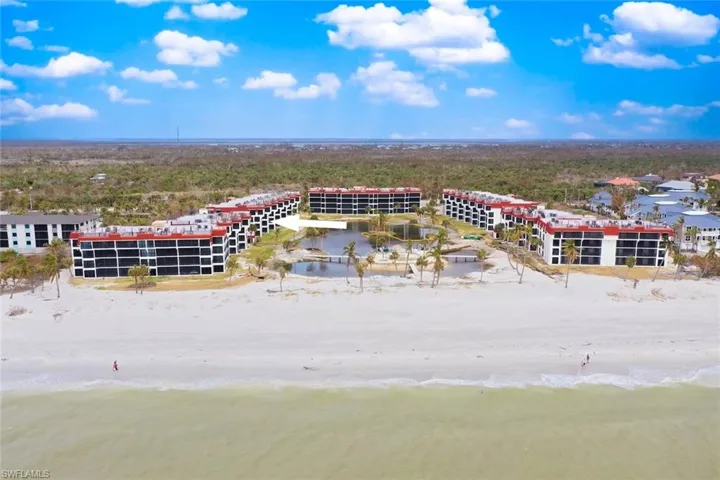 Bird's eye view with a water view and a view of the beach