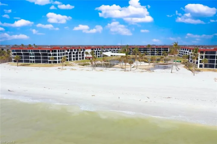 Aerial view with a water view and a beach view
