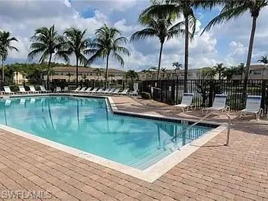Community pool with a patio