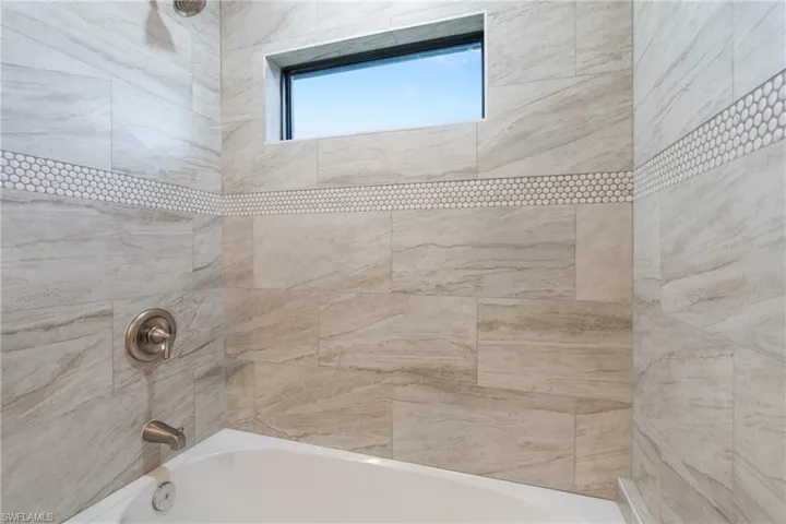 Full bathroom with tub / shower combination