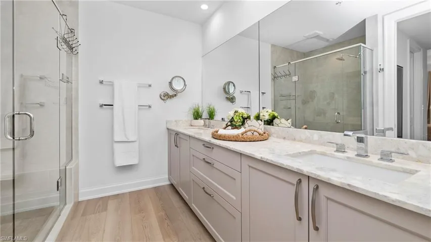 Primary Bathroom double vanity and shower stall