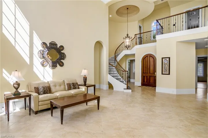 Living room, curved stairs to second floor loft and 2 bedrooms, solid front door entry