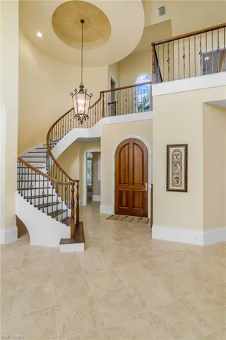 Stairway and 22' ceiling height at second story. Dramatic. Master bedroom suite is on first floor. Second floor perfect for guests.