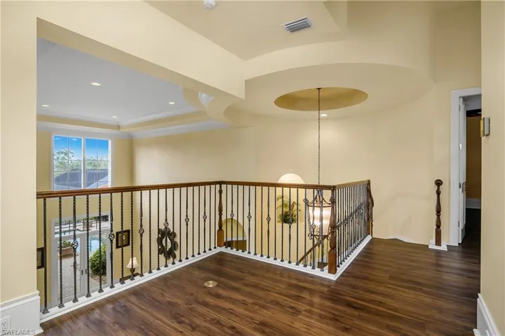 Second floor loft with wood flooring
