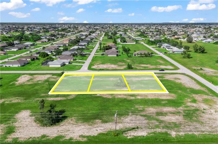 Digital overlay showing the lot lines of the three combined parcels — great visual for buyers to understand the property layout.