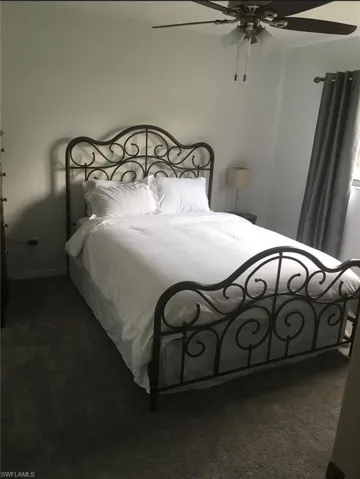 Bedroom featuring carpet floors and a ceiling fan