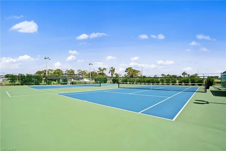 View of tennis court with community basketball court