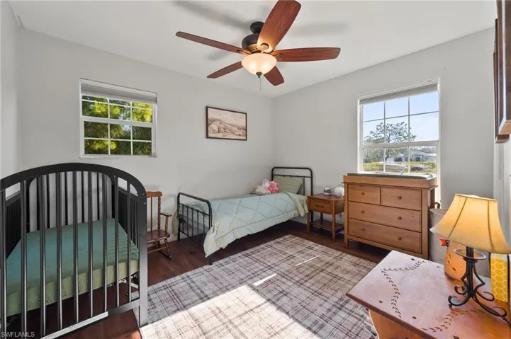 Bedroom featuring a ceiling fan and wood finished floors