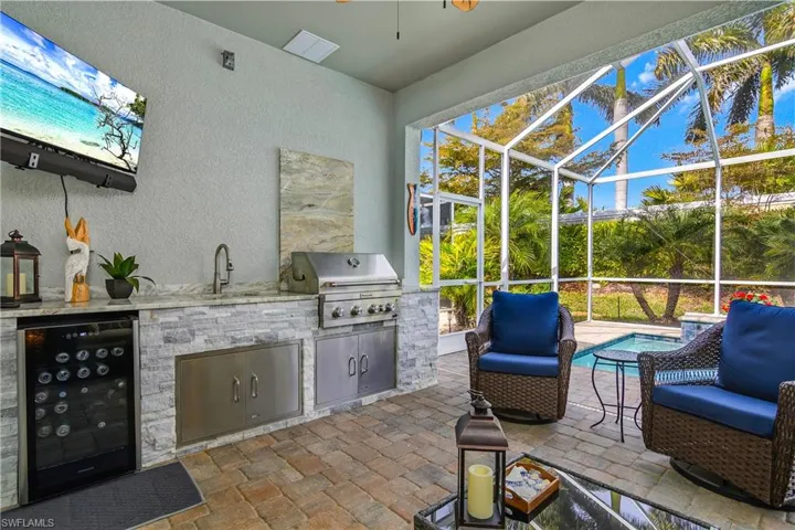 View of lanai featuring wine cooler, and outdoor kitchen