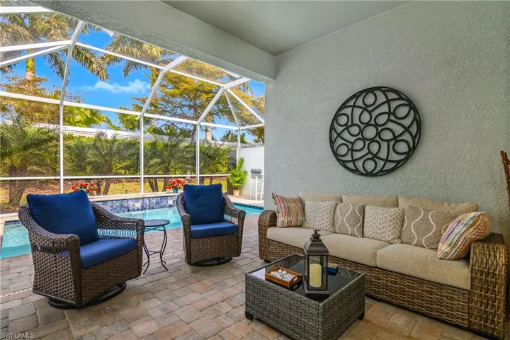 View of lanai, an outdoor pool, and an outdoor lounge area