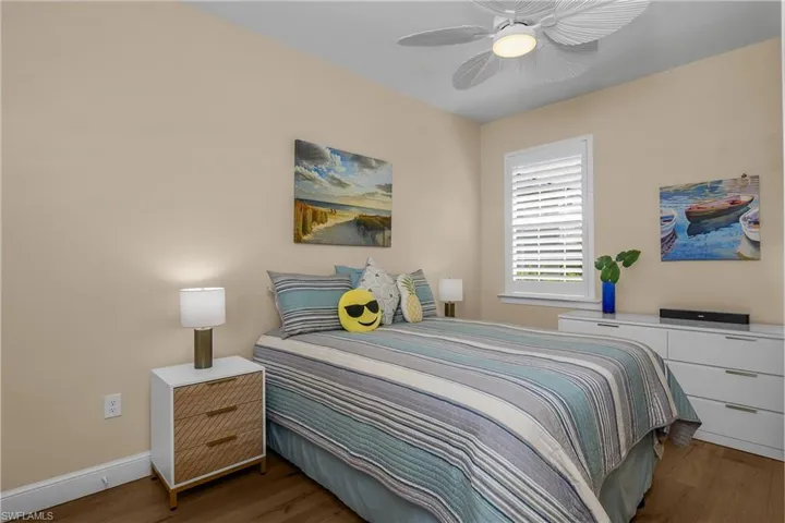 2nd Bedroom with LVP floors and a updated ceiling fan