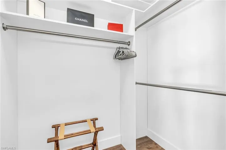 Spacious closet with wood-type flooring