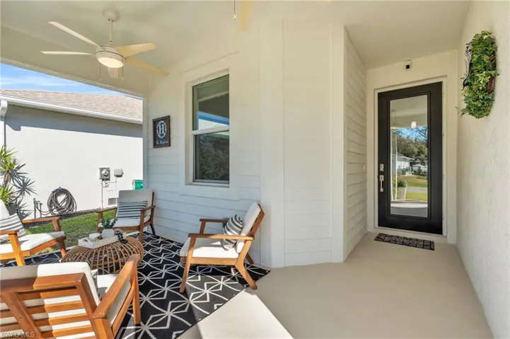 View of exterior entry featuring 2 ceiling fans and new Glass entry door for exceptional light