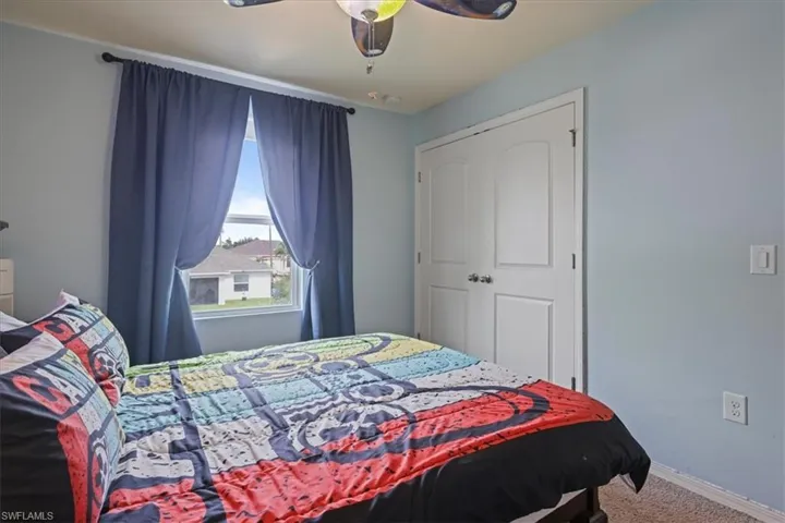Bedroom featuring carpet floors and ceiling fan