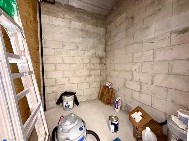 Bathroom with concrete block wall and concrete floors