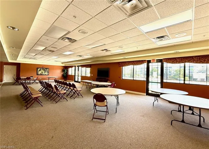 Recreation room with a paneled ceiling