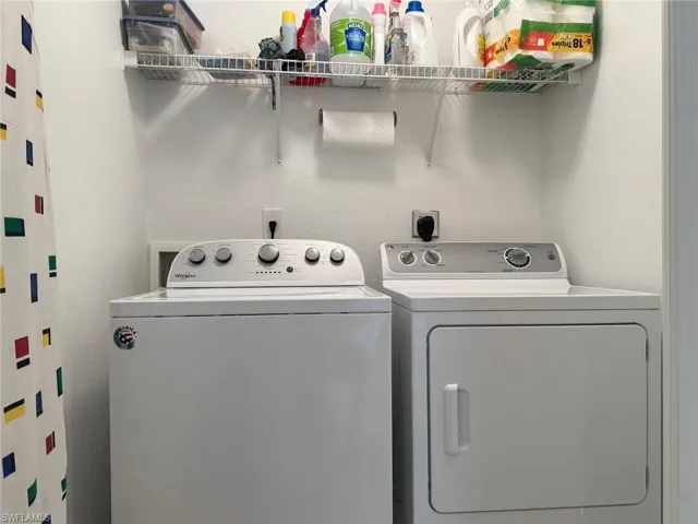 Laundry area featuring washer and clothes dryer
