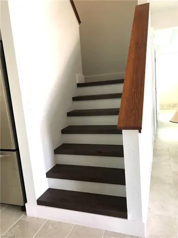 Stairway featuring tile patterned flooring