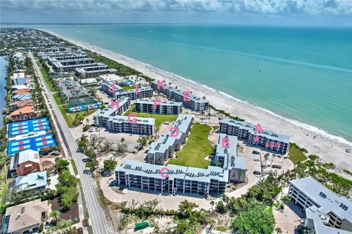 Drone / aerial view featuring a water view and a view of the beach