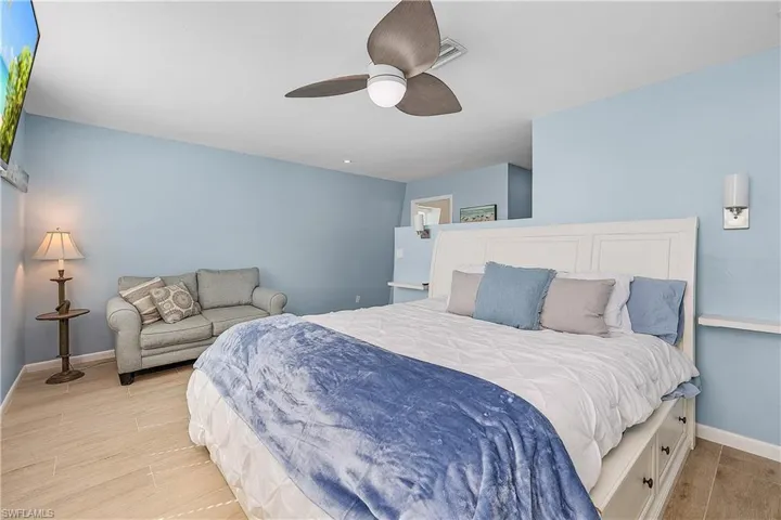 Large primary bedroom with fireplace feature