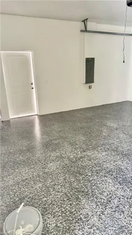 Garage featuring electric panel