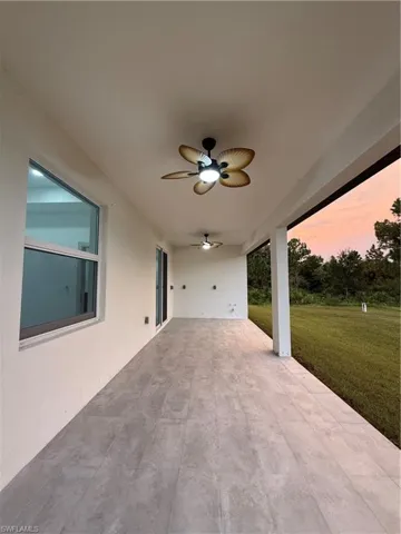 View of patio featuring ceiling fan