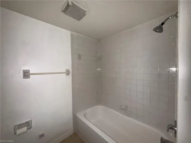 Bathroom featuring shower / washtub combination