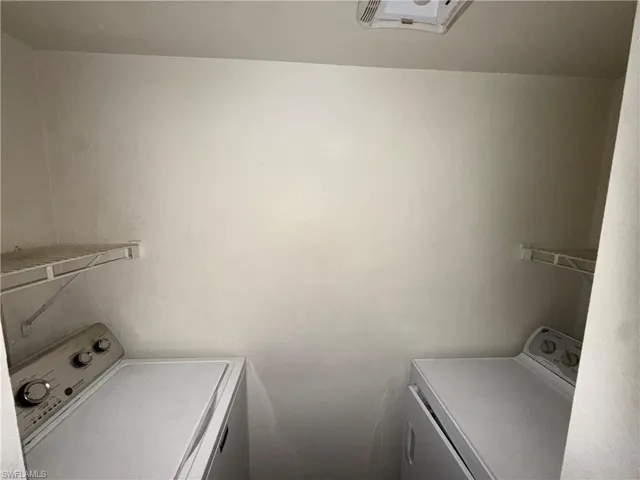 Laundry area featuring independent washer and dryer