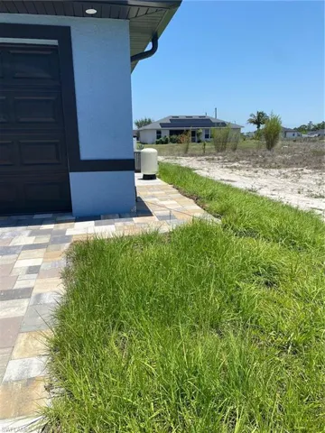 View of yard featuring a garage