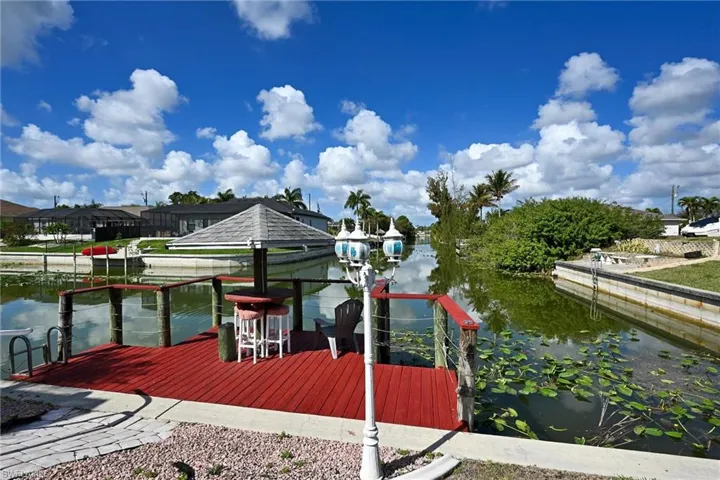 Dock featuring a water view and boat lift