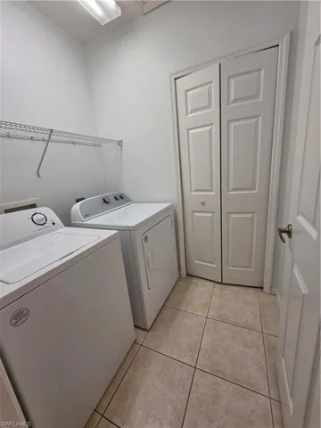 Laundry room with storage closet