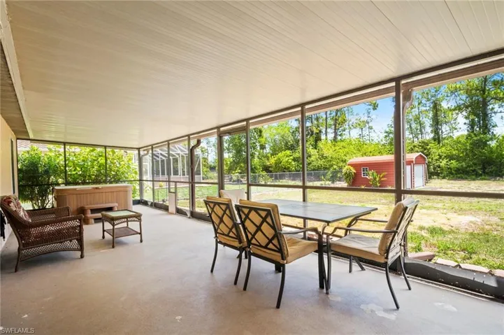 Sunroom featuring outdoor dining area