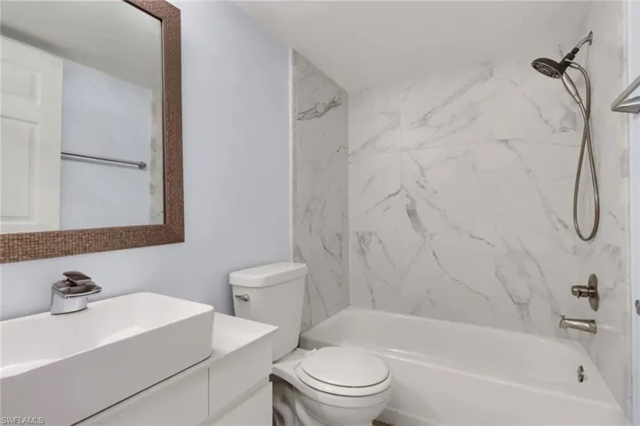 The guest bathroom with a tub & shower combo