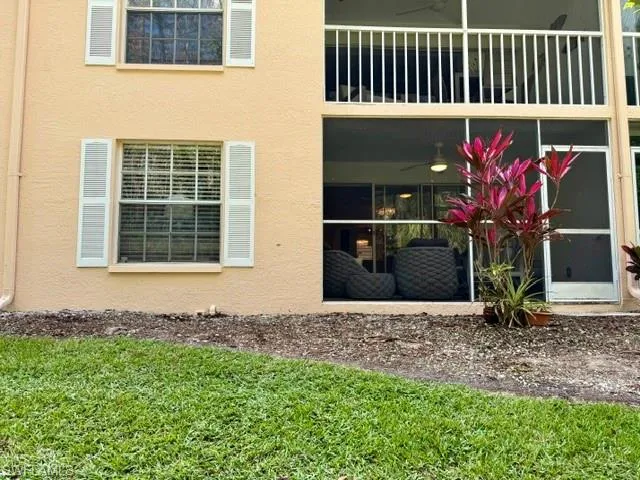 Lush green grass is well maintained among impeccable landscaping
