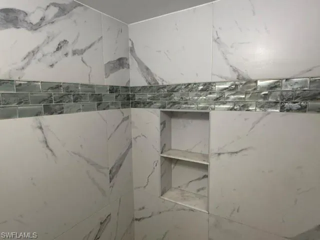 A lustrous custom glass tile inlay. Another sleek feature